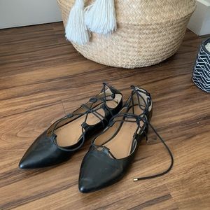 Black leather pointed lace-up flats
